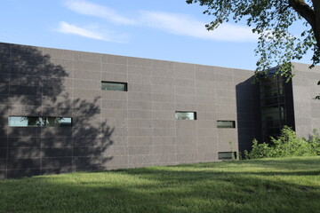 A beautiful and modern outdoor wall of a building with windows. Architecture and building. Modern architecture and windows. Construction industry.