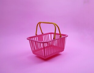 Pink Shopping Cart with Yellow Handle on pink Background