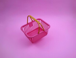 Pink Shopping Cart with Yellow Handle on pink Background