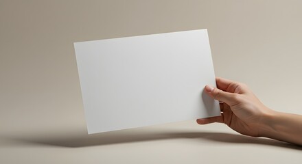 Obraz premium Hand Holding Blank White Paper Sheet - Brochure, Flyer, Invitation Mockup