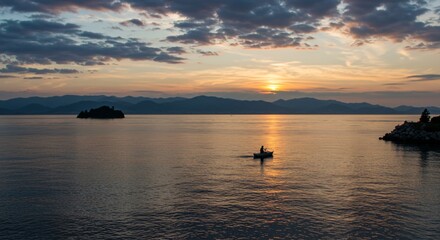 a boat is in the water at sunset