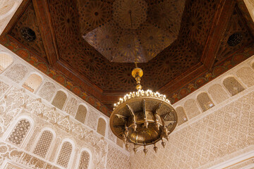 Scenic view of ornate architectural detail in Madrasa Ben Youssef mosque in the Old Town Medina area of Marrakech, west Morocco 