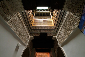 Scenic view of ornate architectural detail in Madrasa Ben Youssef mosque in the Old Town Medina area of Marrakech, west Morocco 