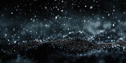 A black and white abstract background featuring a wave-like pattern of small, glowing particles.