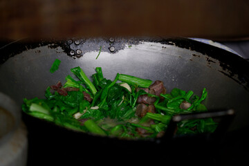Fresh vegetables cooking with dried pork on a hot pan