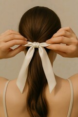 Woman Tying White Hair Ribbon