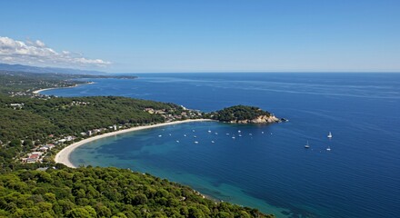 a view of the ocean and a beach from a hill