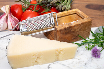 Pieces of matured pecorino romano italian cheese made from sheep milk in Lazio, Sardinia or Tuscany