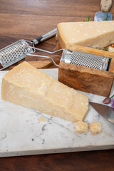 Traditional italian food, 36 months aged in caves Italian parmesan hard cheese from Parmigiano-Reggiano, Italy