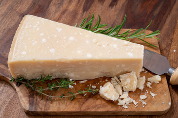 Traditional italian food, 36 months aged in caves Italian hard cheese grana padano from Po river valley, Italy