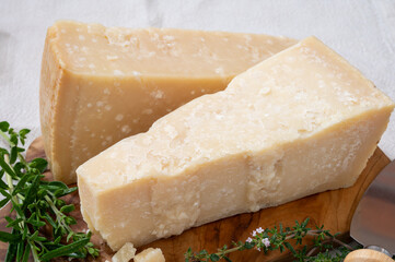 Traditional italian food, 36 months aged in caves Italian parmesan hard cheese from Parmigiano-Reggiano and grana padano from Po river valley, Italy