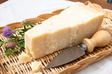 Traditional italian food, 36 months aged in caves Italian parmesan hard cheese from Parmigiano-Reggiano, Italy