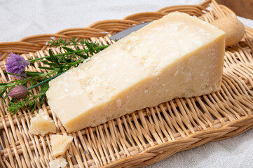 Traditional italian food, 36 months aged in caves Italian parmesan hard cheese from Parmigiano-Reggiano, Italy
