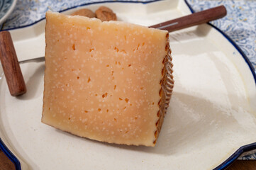 Very old anejo tostado Spanish hard cheese, cow and sheep curado, manchego, goat cheese close up
