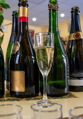 Pouring and tasting of dry sparkling wine brut, grand reserve, champagne in Ay-Champagne wine making village in Vallee de la Marne, , Champagne region, France