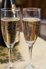 Pouring and tasting of dry sparkling wine brut, grand reserve, champagne in Ay-Champagne wine making village in Vallee de la Marne, , Champagne region, France