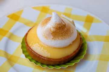 One piece of lemon tart with white eggs meringue from French pastry shop