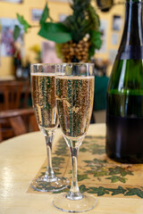 Pouring and tasting of dry sparkling wine brut, grand reserve, champagne in Ay-Champagne wine making village in Vallee de la Marne, , Champagne region, France