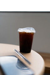 Iced americano coffee on table at coffee shop in the morning