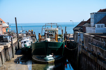 Fishing boats at low tide time in Oosterschelde, Zeeuwse oysters village Yerseke, Zeeland, The...
