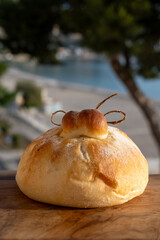 Fresh baked bread in burrata cheese shape filled with tomatoes, vegetables, parmaham and cheese, street food in Palermo, Sicily, Italy, served outdoor for lunch