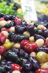 Colorful assortment of olives at grocery store display