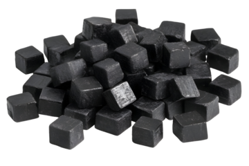 Heap of shiny black stone cubes on a black background evokes modern design
