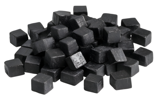 Heap of shiny black stone cubes on a black background evokes modern design