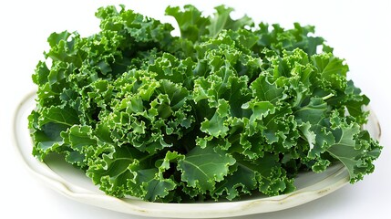 Fototapeta premium A close-up of a bunch of crisp and vibrant green kale leaves arranged on a white ceramic plate with their curly edges and rich green color