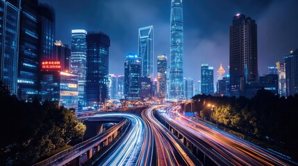 Fototapeta premium Cityscapes at night with illuminated skyscrapers and motion blur on highways.