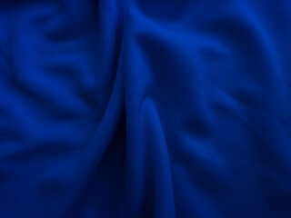 Wrinkled fabric texture. Blue wavy cloth background