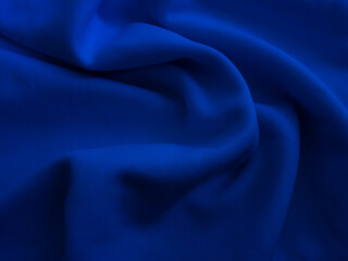 Wrinkled fabric texture. Blue wavy cloth background
