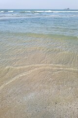 Wave of the sea on the sand beach