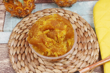 a bowl of pineapple jam