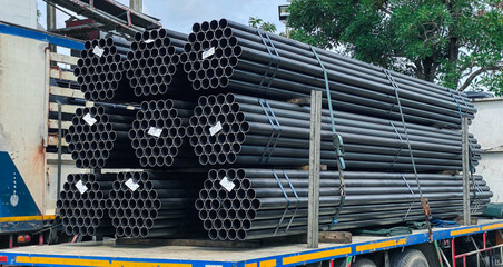 Black steel pipes in various sizes and configurations, ready for use in the construction steel...