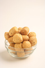 Fish crackers in glass bowl on white background
