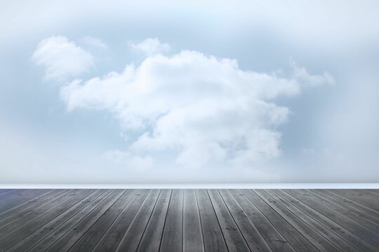Fototapeta Flat design scene is showing empty wooden deck stretching toward horizon with billowy white clouds