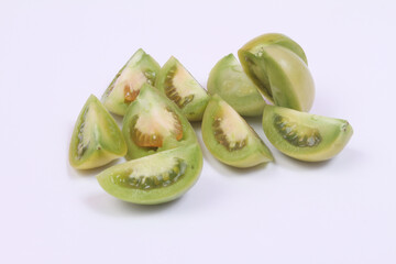 green tomatoes on white background