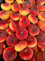 Appetizing peach background, close-up top view. Fresh fruits for good health.