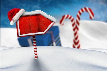 Holiday arrow sign is being shown in flat vector design with Santa hat, candy cane post