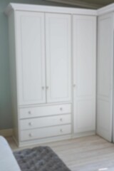 Defocused image of white wardrobe