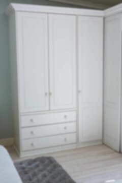 Fototapeta Defocused image of white wardrobe