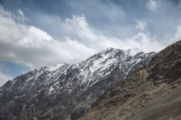 Majestic snow-covered Himalayan peak seen from Diskit Monastery in Nubra Valley, Ladakh — serene...