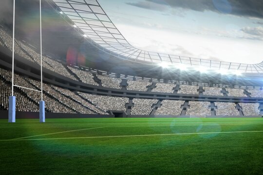 Rugby goal posts with blue padding are standing on turf under floodlights in flat design