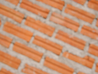 Blur old red brick wall texture vintage diagonal background, rustic urban exterior.