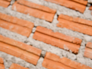 Blur old red brick wall texture vintage diagonal background, rustic urban exterior.