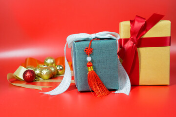 minimal flat lay chinese new year decoration item and gift box on red background