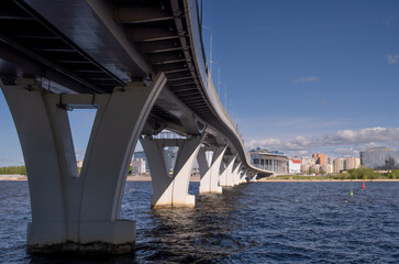 Fototapeta premium yacht bridge St. Petersburg. A concrete bridge with pillars across the bay.