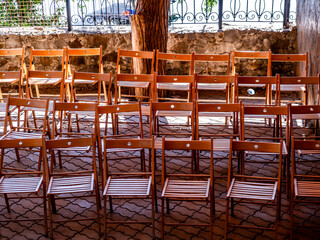 Wooden chairs on the veranda in summer.