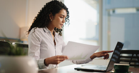 Business, documents and woman in office, laptop and online reading with charts for tax report....